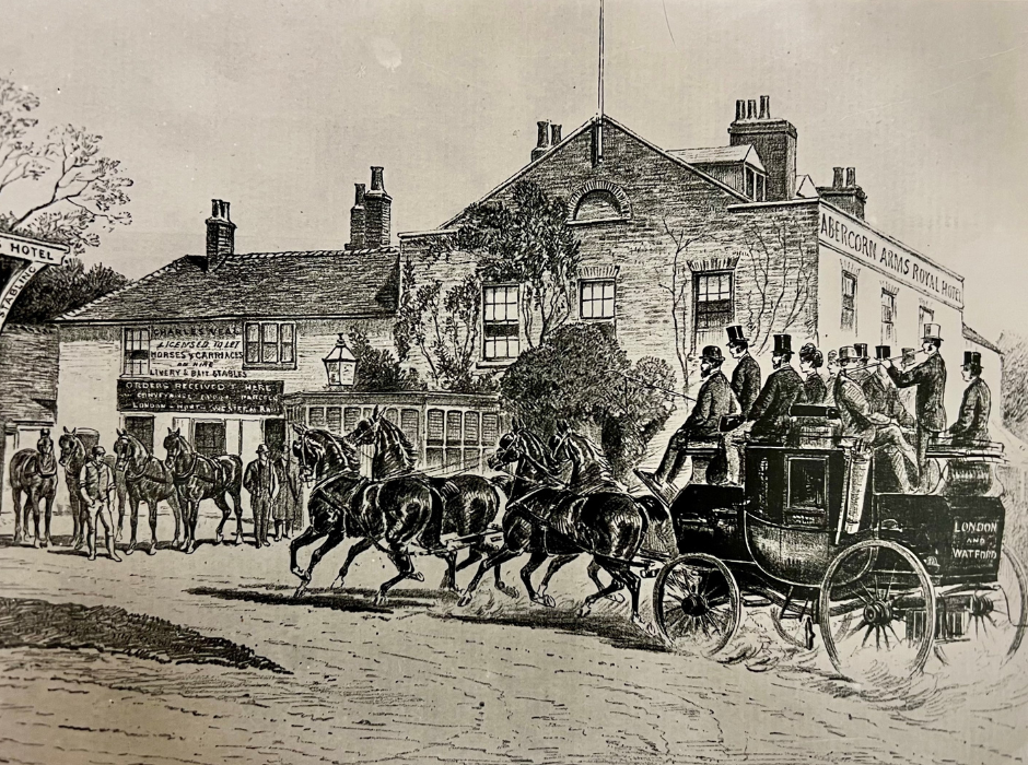 A black and white drawing of a horse and carriage in front of an of building